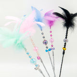 Colored feather bells, funny cats, fairy sticks