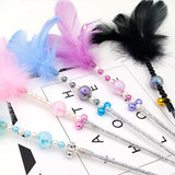 Colored feather bells, funny cats, fairy sticks
